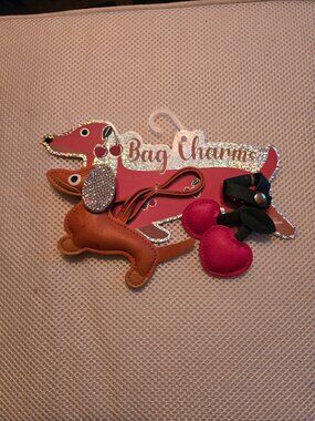 2 cute bag charms, dog & cherry. Fun to add to your purse or luggage